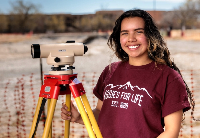 An NSMU student using a surveying tool