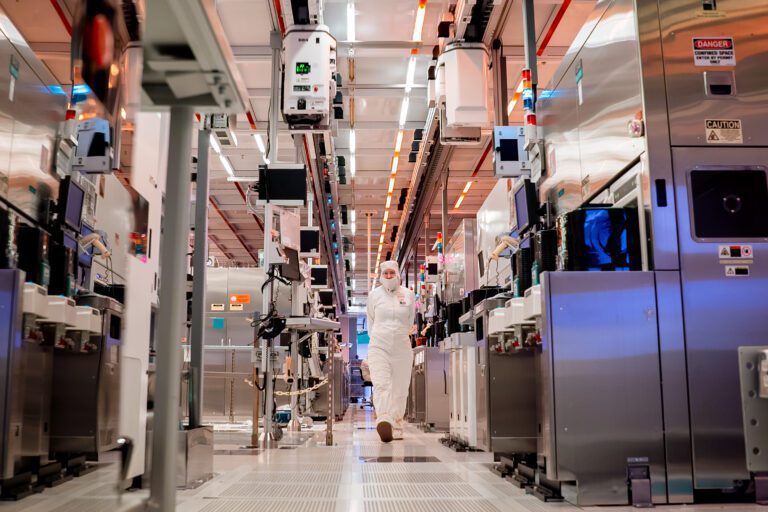 Margaret Henschel, one of the more than 50,000 Intel employees in the United States, moves through Fab 32, a high-volume manufacturing facility in Chandler, Arizona.